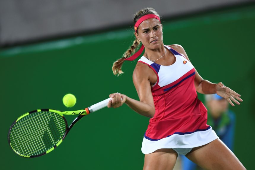 Puerto Rico's Monica Puig returns the ball to Germany's Angelique Kerber during their women's singles finals tennis match at the Olympic Tennis Centre of the Rio 2016 Olympic Games in Rio de Janeiro on August 13, 2016. / AFP / Martin BERNETTI        (Photo credit should read MARTIN BERNETTI/AFP/Getty Images)